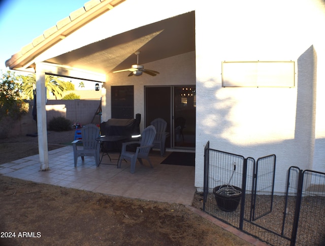 view of patio featuring ceiling fan