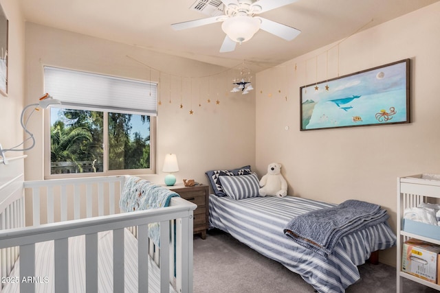 bedroom with a ceiling fan, visible vents, and carpet