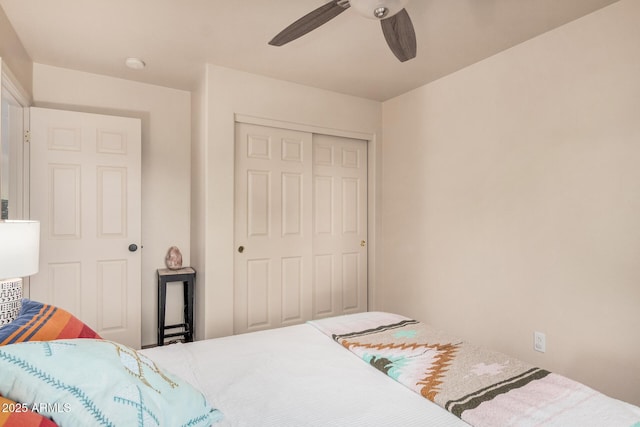 bedroom featuring a closet and a ceiling fan