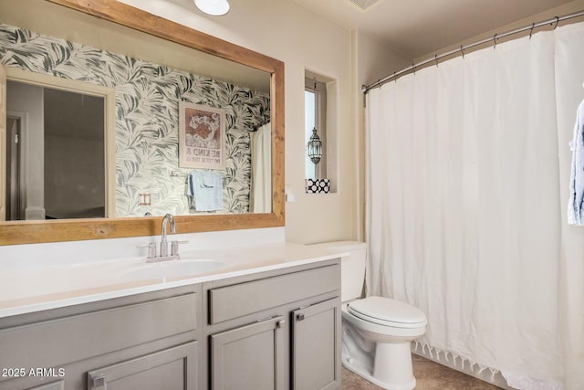 full bathroom featuring vanity, tile patterned floors, and toilet
