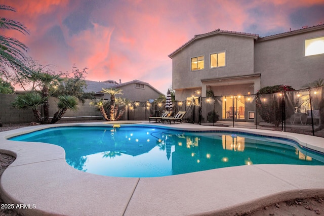 view of pool with a fenced in pool, a fenced backyard, and a patio area