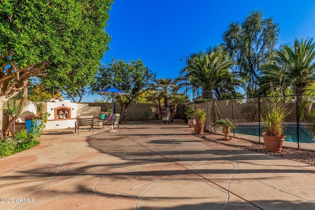 view of patio with a fenced in pool and a fenced backyard