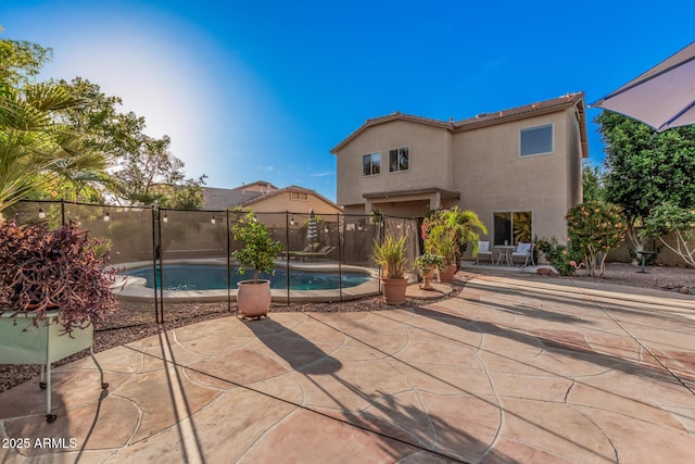 view of swimming pool featuring a fenced in pool, a patio area, and fence