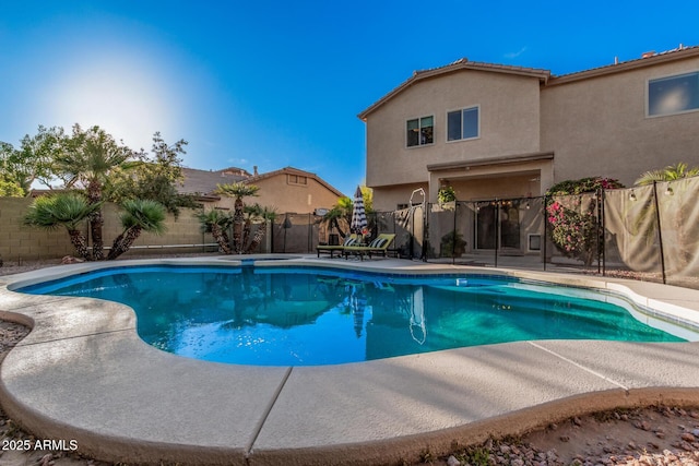 view of swimming pool with a fenced in pool, a patio, and a fenced backyard