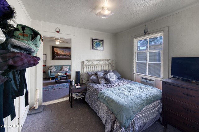 514 Brophy Ave, Bisbee, AZ 85603 - carpeted bedroom featuring an AC wall unit and ornamental molding