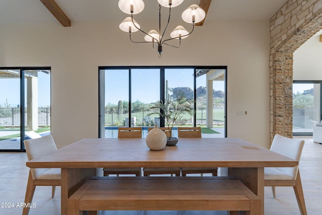 unfurnished dining area with beam ceiling, plenty of natural light, and a notable chandelier