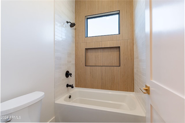 bathroom with toilet and tub / shower combination