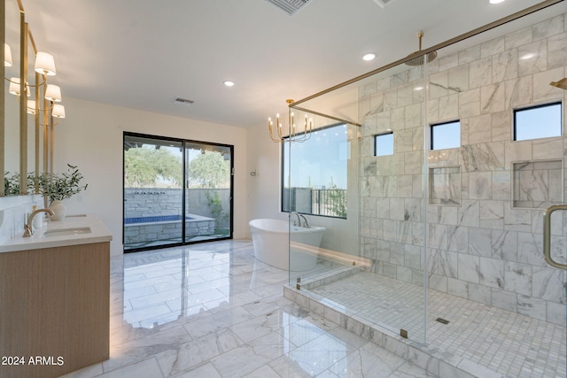 bathroom featuring vanity and separate shower and tub