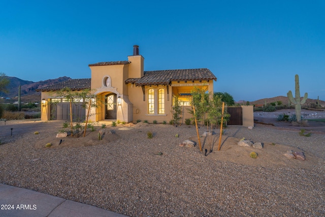 mediterranean / spanish-style home with a mountain view