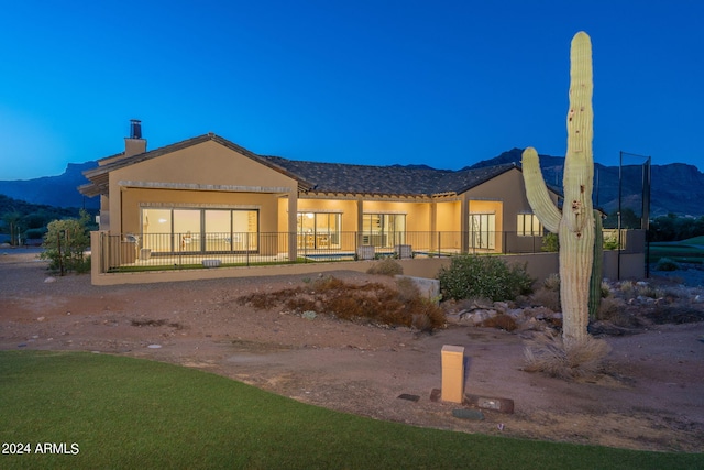 back of property with a mountain view