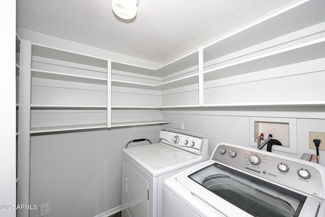 washroom with laundry area and washing machine and dryer