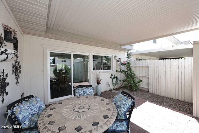 view of patio featuring fence