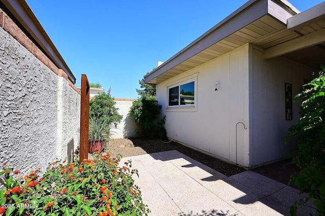 view of patio / terrace featuring fence