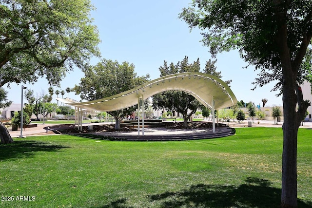view of property's community with a lawn