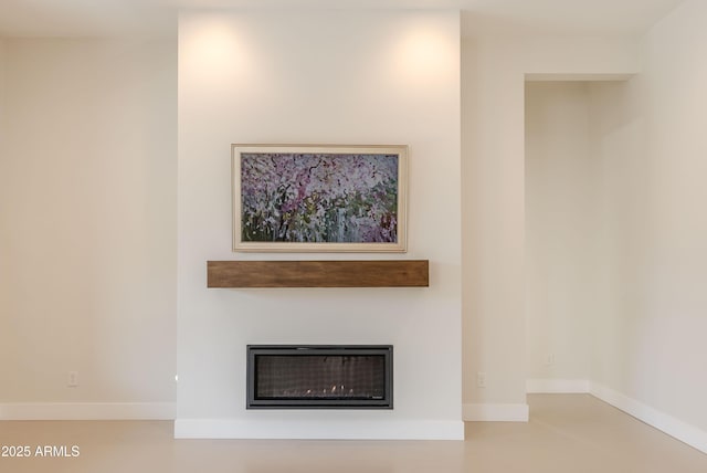 3145 E Boot Track Trl, Gilbert, AZ 85296 - detailed view of a glass covered fireplace and baseboards