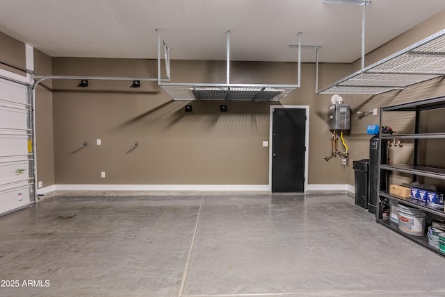 3145 E Boot Track Trl, Gilbert, AZ 85296 - garage with baseboards and tankless water heater