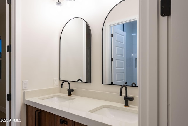 full bath with double vanity and a sink