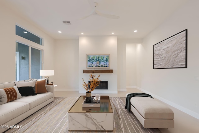 living room with baseboards, a ceiling fan, recessed lighting, and visible vents