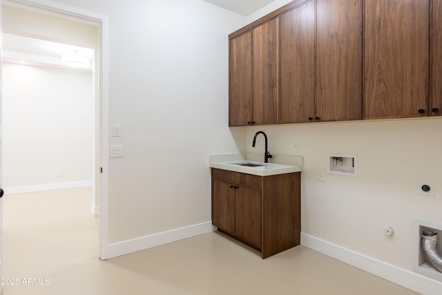 washroom featuring gas dryer hookup, electric dryer hookup, a sink, cabinet space, and washer hookup