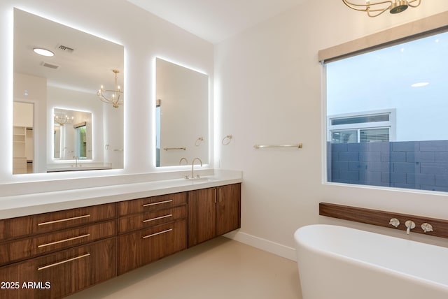 full bath featuring visible vents, baseboards, vanity, and a soaking tub