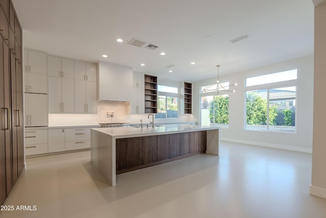 kitchen with modern cabinets, open shelves, light countertops, white cabinets, and recessed lighting