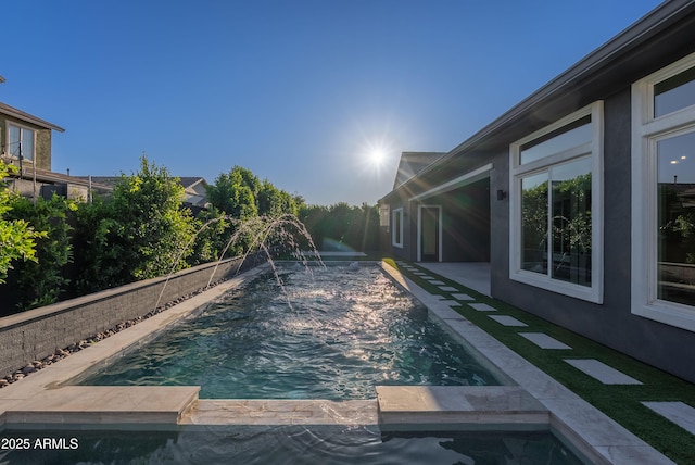 view of pool featuring a pool with connected hot tub