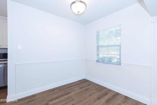 1006 S Una Ave, Tempe, AZ 85281 - empty room with dark wood-style flooring and wainscoting