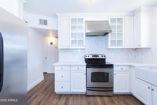 1006 S Una Ave, Tempe, AZ 85281 - kitchen with stainless steel appliances, exhaust hood, white cabinetry, dark wood-type flooring, and decorative backsplash