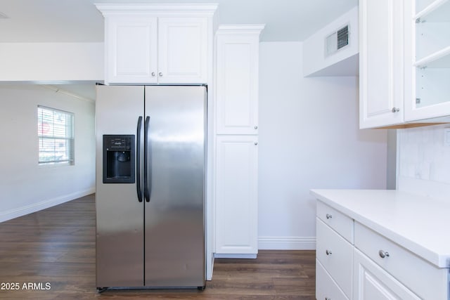 1006 S Una Ave, Tempe, AZ 85281 - kitchen featuring stainless steel fridge, dark wood-type flooring, white cabinets, and light countertops