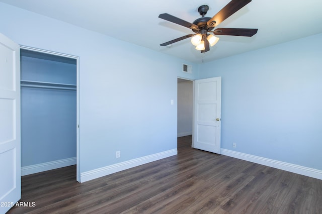 1006 S Una Ave, Tempe, AZ 85281 - unfurnished bedroom with dark wood-style flooring, a closet, and ceiling fan