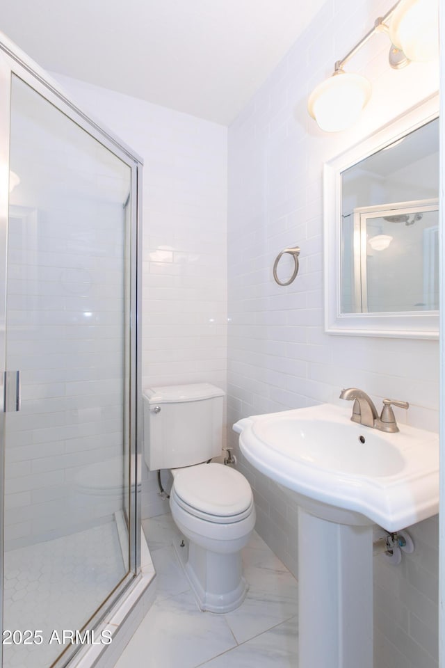 1006 S Una Ave, Tempe, AZ 85281 - bathroom featuring tile walls, a stall shower, and marble finish floors