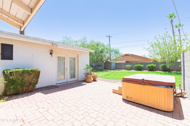 1006 S Una Ave, Tempe, AZ 85281 - fenced backyard with a hot tub, a patio, french doors, and a storage unit