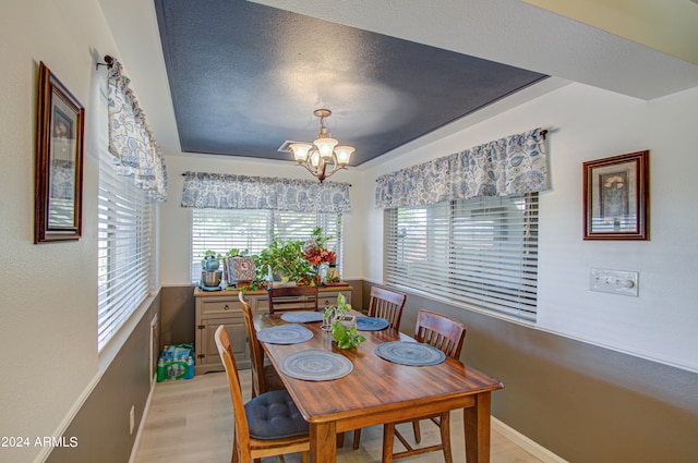 dining room featuring a chandelier and light wood-type flooring