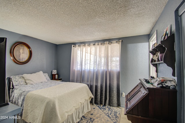 bedroom featuring a textured ceiling