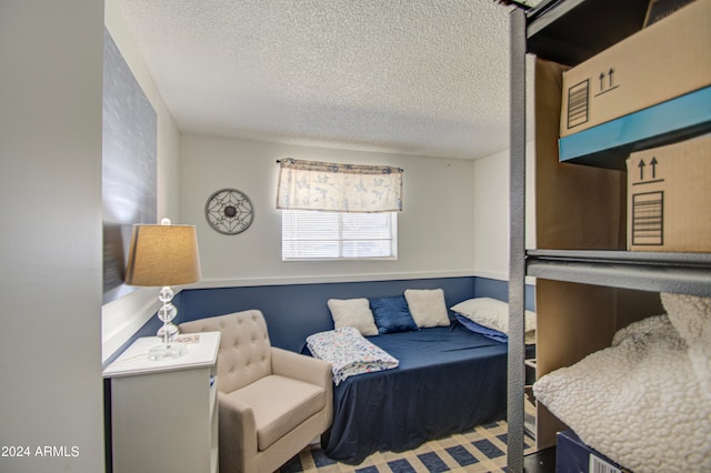 bedroom featuring a textured ceiling