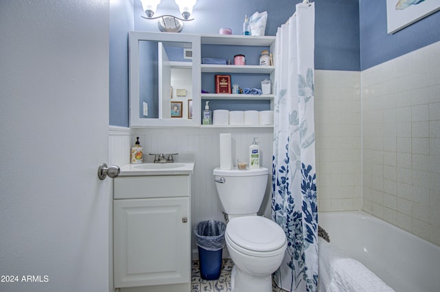 full bathroom featuring toilet, shower / tub combo with curtain, and vanity