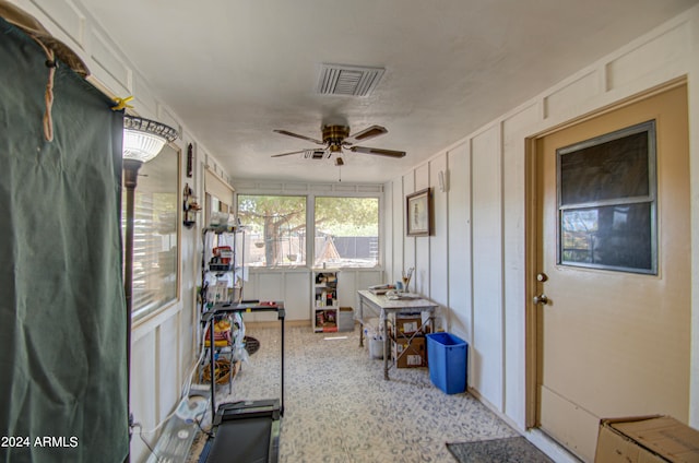 sunroom / solarium with ceiling fan