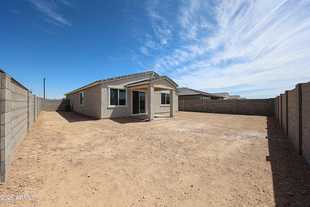 back of property featuring a patio, a fenced backyard, and stucco siding