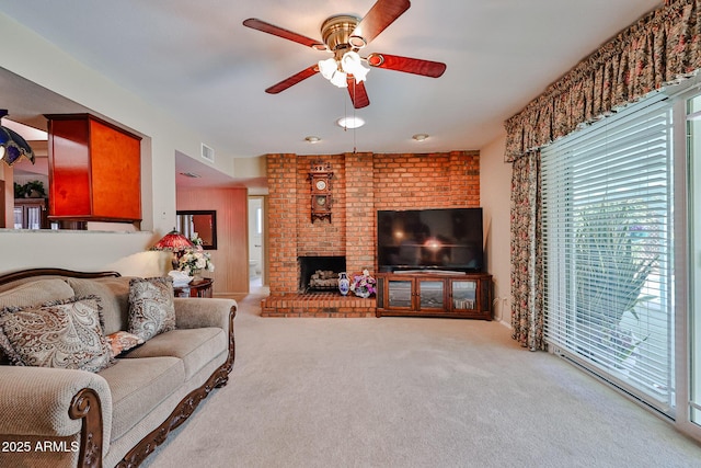 5349 W Acapulco Ln, Glendale, AZ 85306 - living room featuring a ceiling fan, carpet flooring, and a brick fireplace