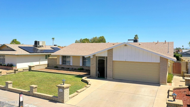 5349 W Acapulco Ln, Glendale, AZ 85306 - single story home featuring brick siding, a garage, roof with shingles, and concrete driveway