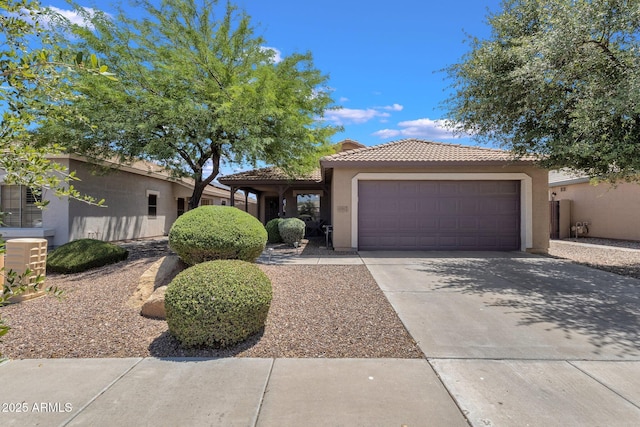 4101 S Dewdrop Ct, Gilbert, AZ 85297 - view of front facade with stucco siding, an attached garage, a tile roof, and driveway