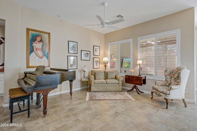 living area featuring ceiling fan