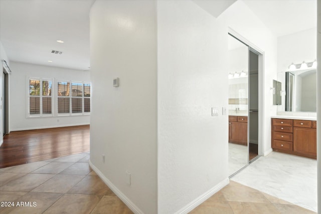 hallway with light tile patterned floors