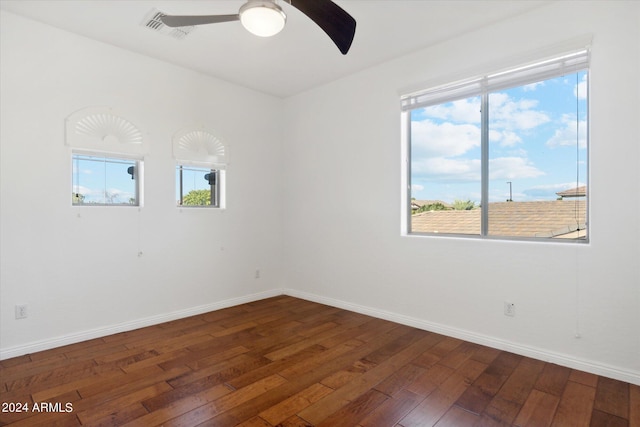 unfurnished room featuring dark hardwood / wood-style floors and ceiling fan