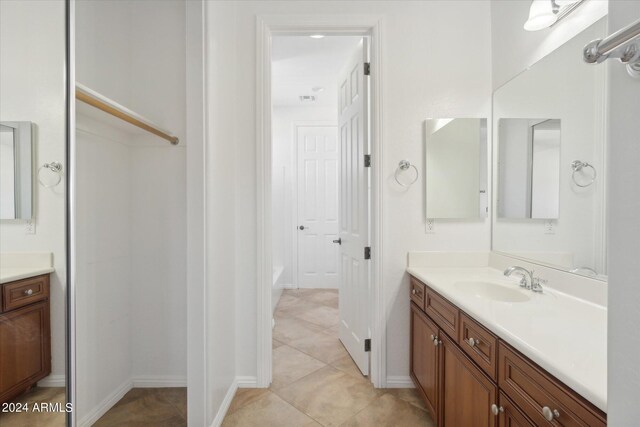 bathroom featuring tile patterned floors and vanity