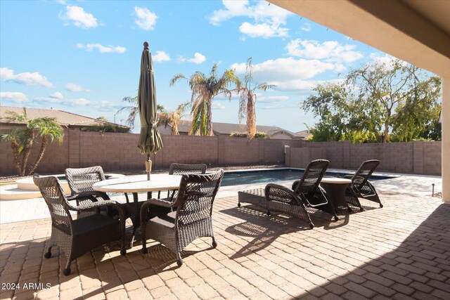 view of patio featuring a fenced in pool