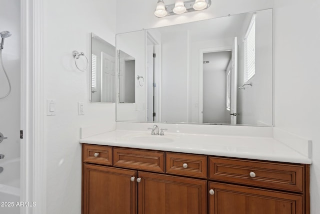 bathroom with bathing tub / shower combination and vanity