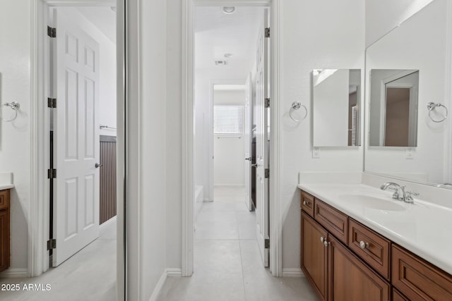 bathroom with tile patterned flooring and vanity