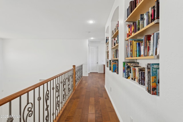 hall with dark hardwood / wood-style floors