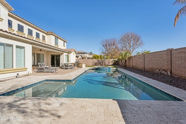 view of swimming pool featuring an in ground hot tub, ceiling fan, and a patio area